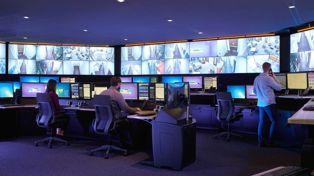 Providence Technologies engineers monitoring live systems in a command center